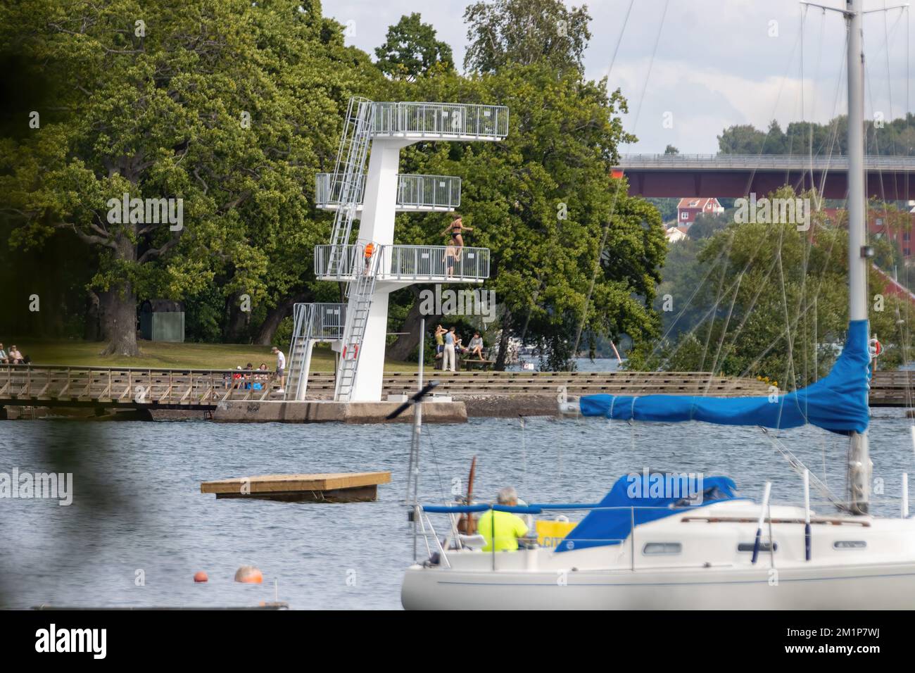 Motala Sweden August 2022 Jumping tower with four height levels of 3m, 5m, 7m and 10m and jump into the fresh water lake Stock Photo