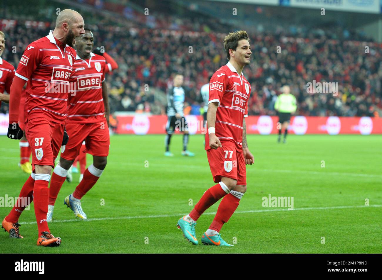 20121207 - LIEGE, BELGIUM: Standard's Maor Bar Buzaglo (R) celebrates after scoring the 3-0 goal during the Jupiler Pro League match between Standard and Charleroi, in Liege, Friday 07 December 2012, on day 19 of the Belgian soccer championship. BELGA PHOTO YORICK JANSENS Stock Photo