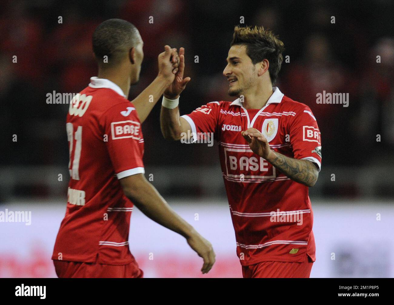 20121207 - LIEGE, BELGIUM: Standard's Maor Bar Buzaglo (R) celebrates after scoring the 3-0 goal during the Jupiler Pro League match between Standard and Charleroi, in Liege, Friday 07 December 2012, on day 19 of the Belgian soccer championship. BELGA PHOTO JOHN THYS Stock Photo