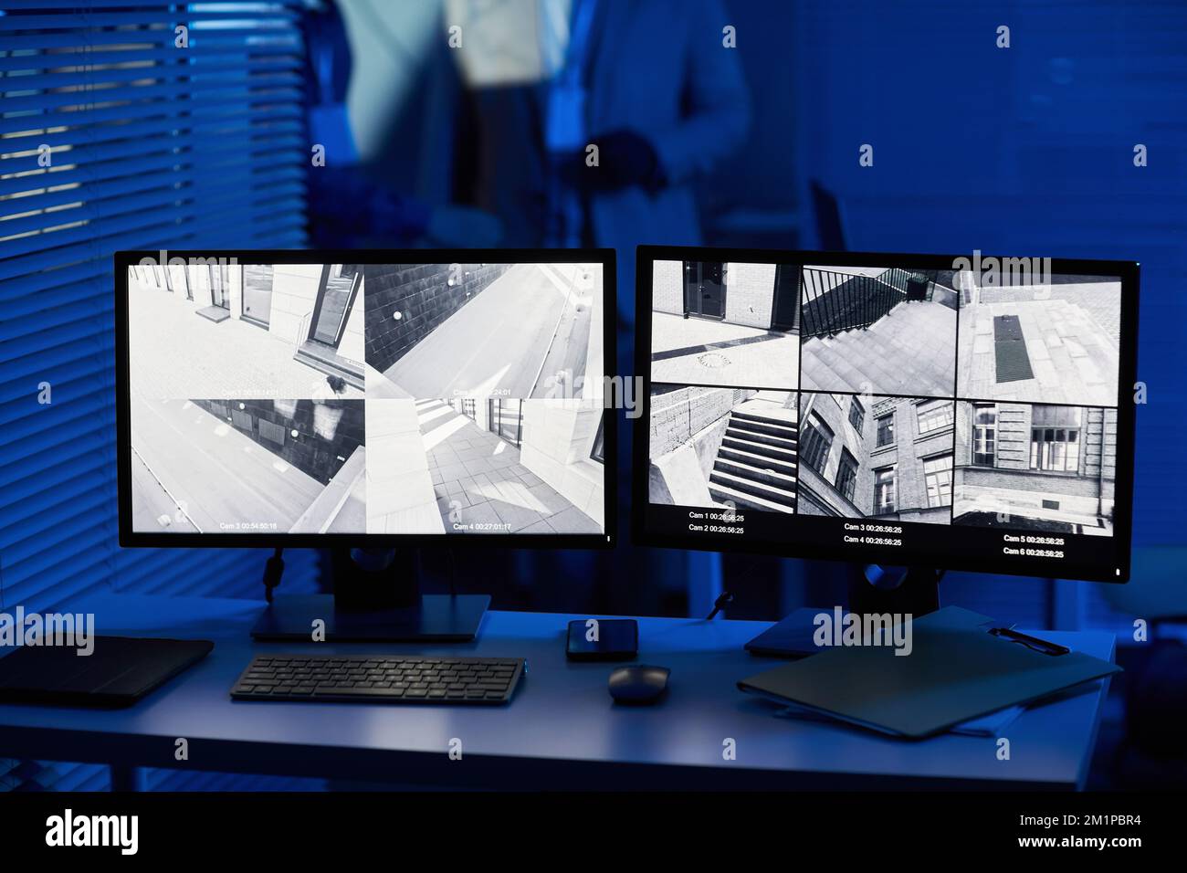Background image of computer screens with surveillance camera footage