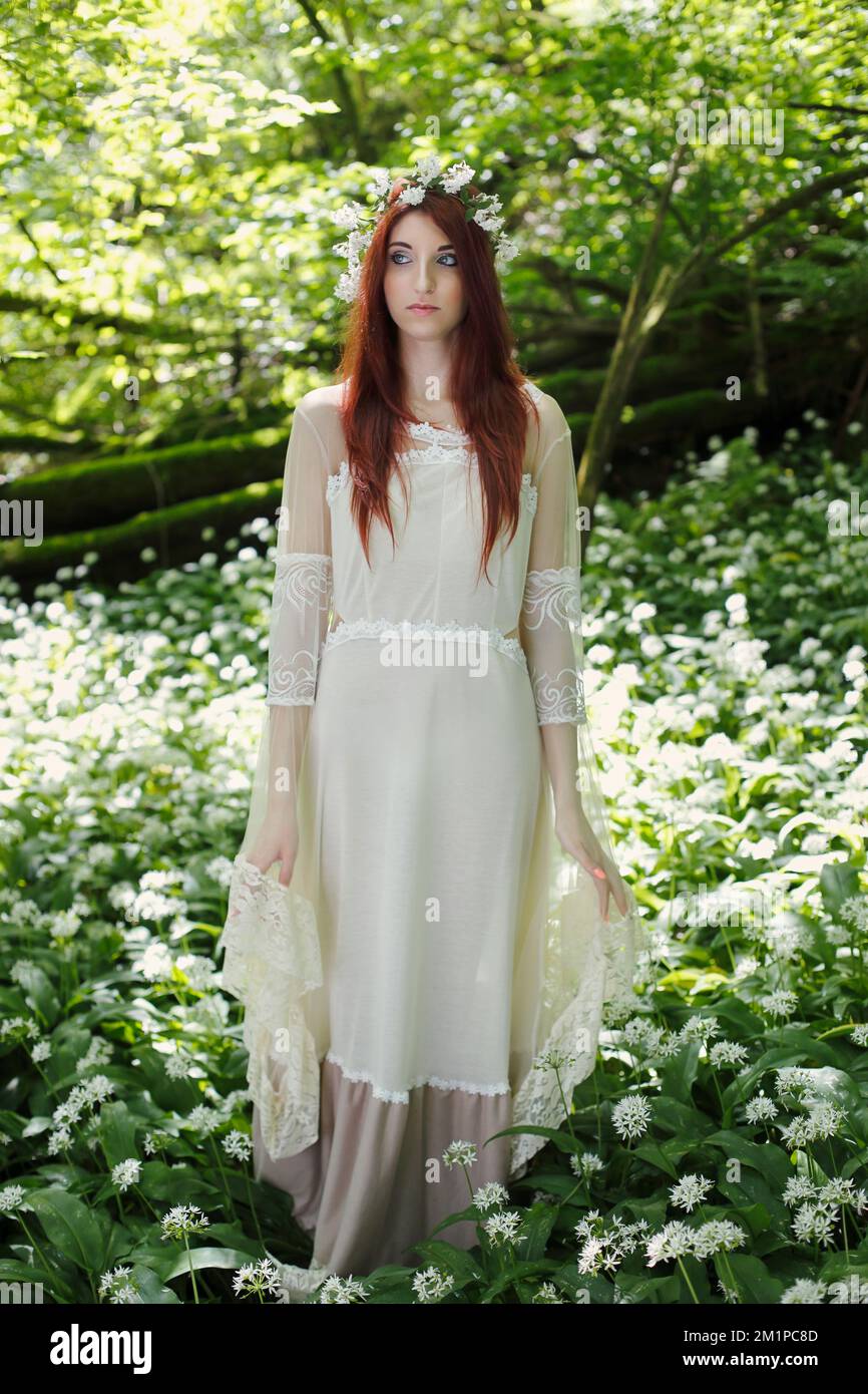 Ethereal woman in fantasy forest Stock Photo