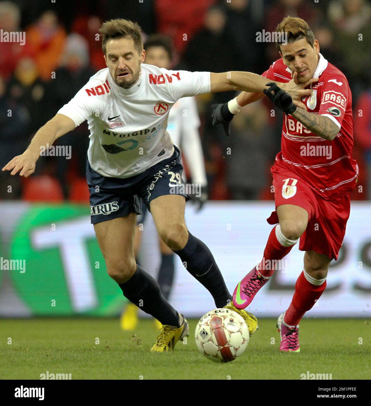 20130125 - LIEGE, BELGIUM: Kortrijk's Romain Reynaud and Standard's Maor Bar Buzaglo fight for the ball during the Jupiler Pro League match between Standard de Liege and KV Kortrijk, in Liege, Friday 25 January 2013, on day 24 of the Belgian soccer championship. BELGA PHOTO VIRGINIE LEFOUR Stock Photo