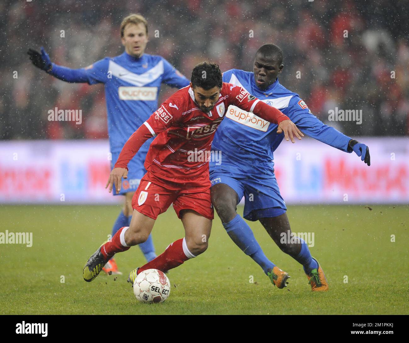 Standard's Reza Ghoochannejhad and Genk's Kara Mbodj fight for the ball during the Jupiler Pro League match between Standard de Liege and RC Genk, in Liege, Sunday 24 February 2013, on day 28 of the Belgian soccer championship. Stock Photo