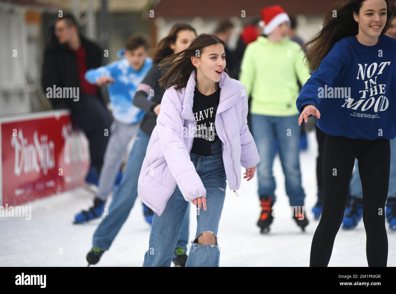 Young girls ice skating in Varazdin during winter, Croatia Stock Photo