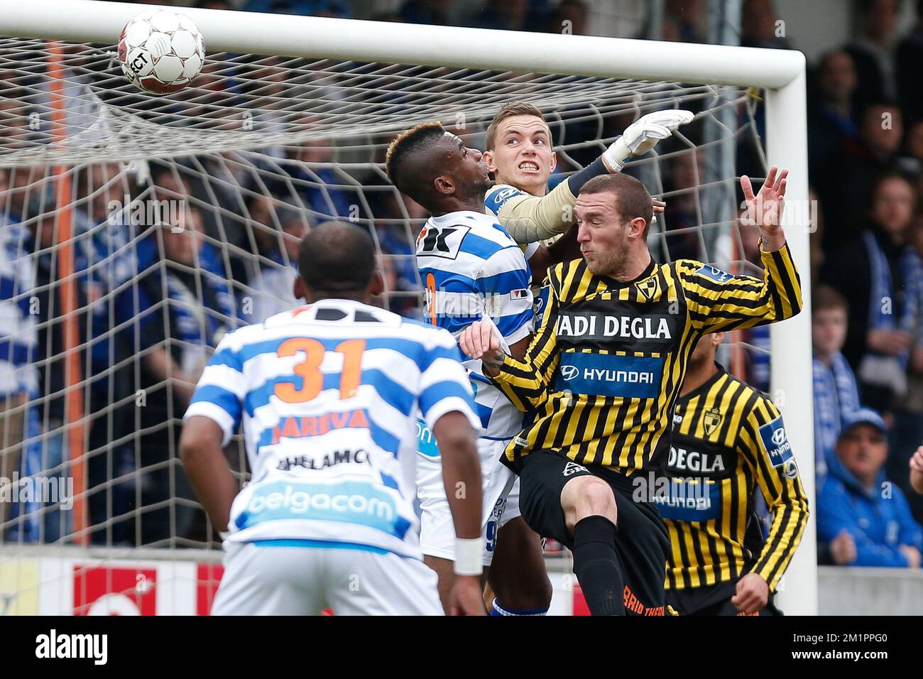 Gent's Ilombe Mboyo, Lierse's goalkeeper Nathan Goris and Lierse's Benjamin Lambot fight for the ball during the Jupiler Pro League match of Play-Off 2 group A, between Lierse SK and AA Gent, in Lier, Saturday 13 April 2013 Stock Photo