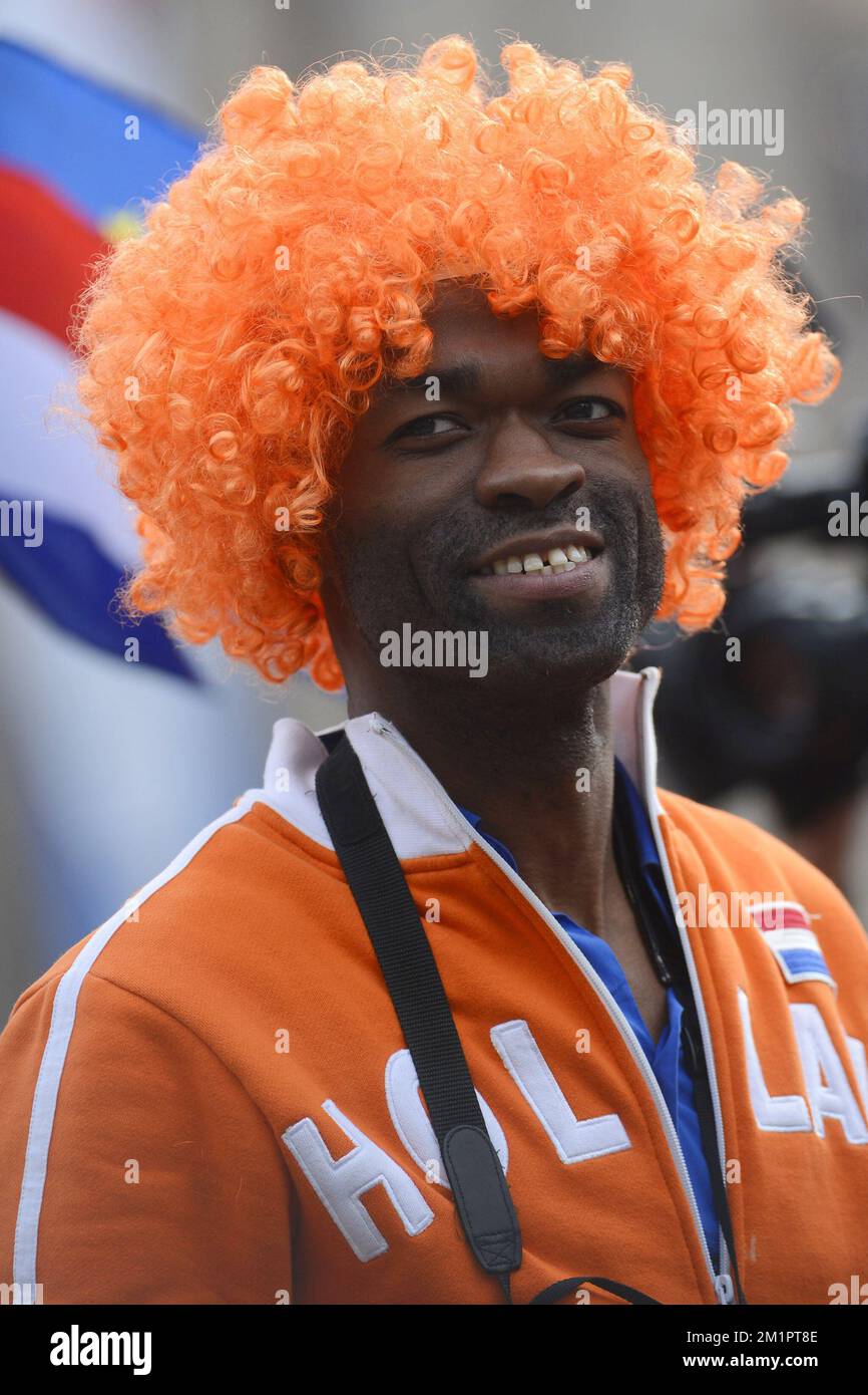 A man wearing an orange wig pictured during the investiture of Prince Willem Alexander as King, Tuesday 30 April 2013, in Amsterdam, The Netherlands. Dutch Queen Beatrix, who ruled the Netherlands for 33 years, announced on 28,January 2013 her abdication from the throne in favour of her son, Prince Willem-Alexander.   Stock Photo
