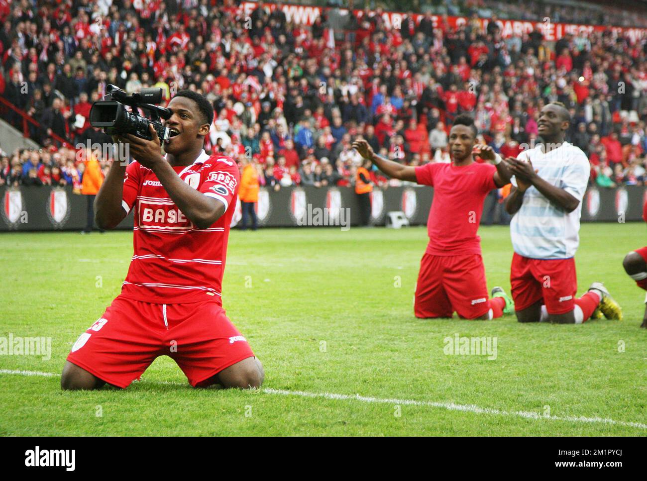 20130526 - LIEGE, BELGIUM: Standard's Michy Batshuayi films with a camera  after winning the match Standard de Liege versus AA Gent, the return leg in  the final of the fourth team in