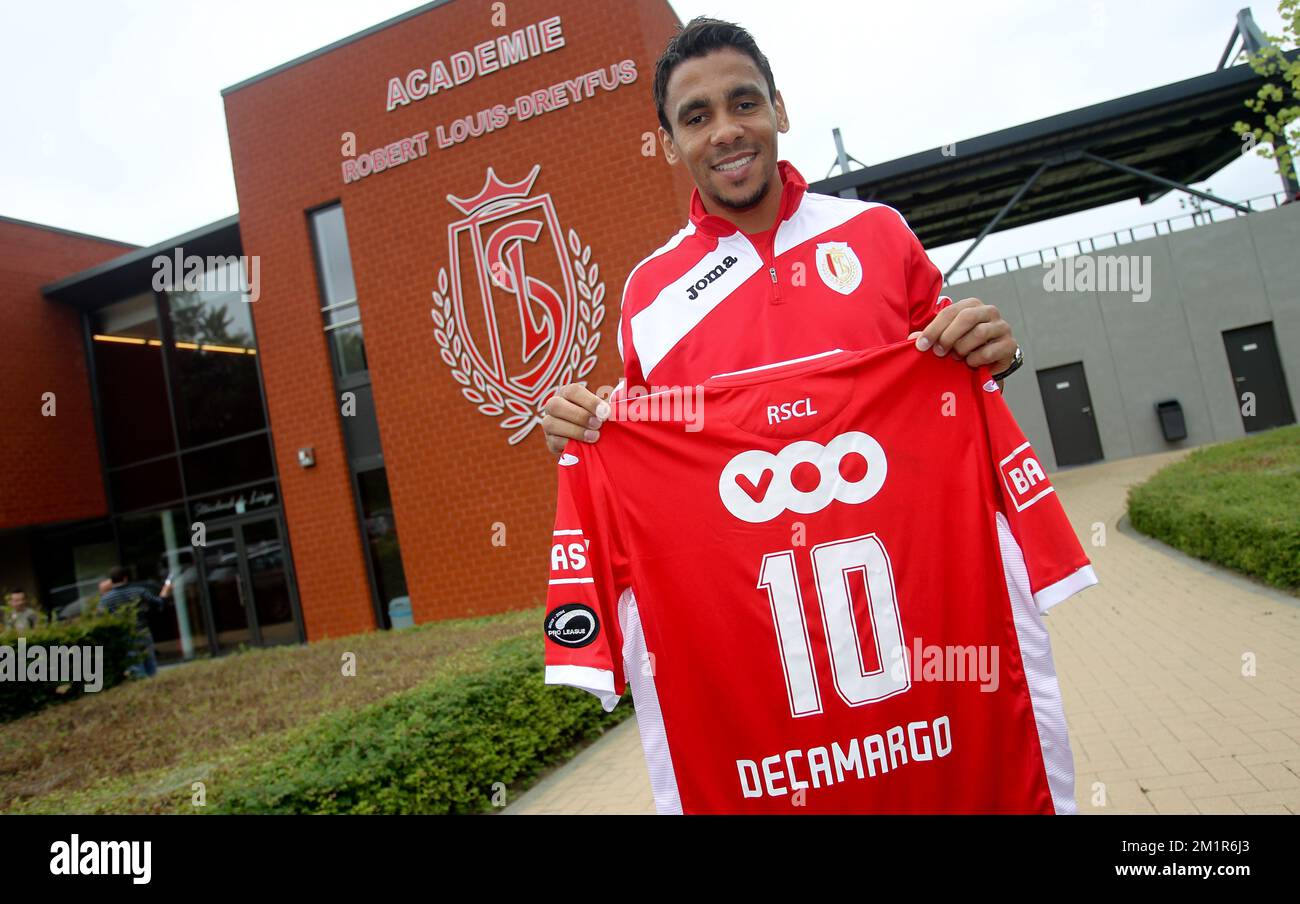 Standard's Igor de Camargo poses with his new shirt after a press conference of Belgian first division soccer team Standard de Liege, Thursday 11 July 2013 in Liege. Standard is presenting latest signing Igor de Camargo, who played for the club from 2006 to 2010.  Stock Photo