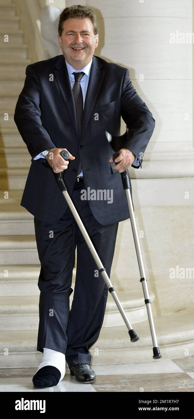 Brussels region Minister-President Rudi Vervoort (PS) pictured with crutches during a reception at the royal castle in Laeken - Laken, Brussels for the Minister-Presidents of the regions and communities during the reign of King Albert II of Belgium, Friday 12 July 2013.  Stock Photo