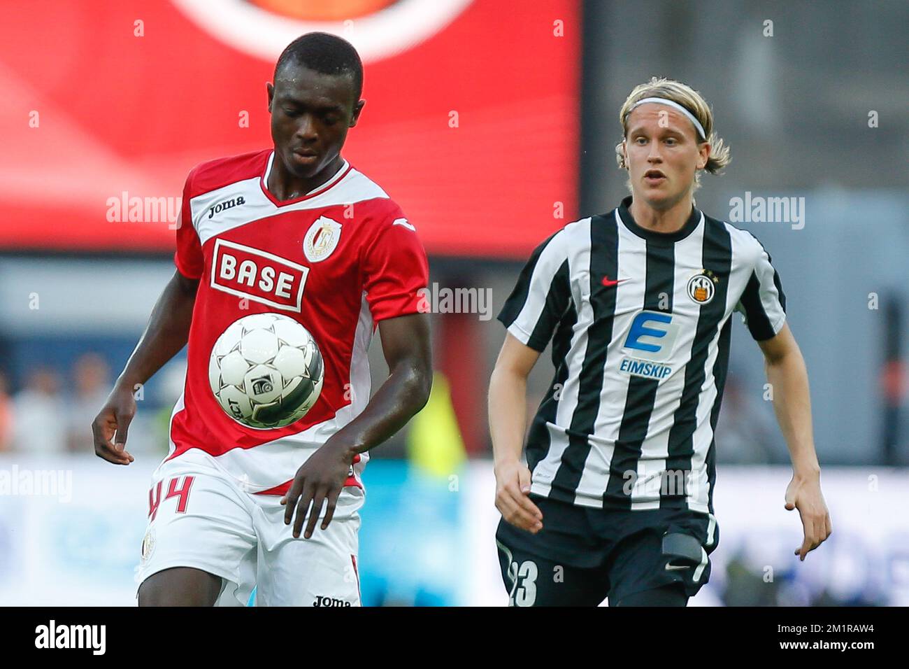 Standard's Ibrahima Cisse and KR Reykjavikís Alti Sigurjonsson fight for the ball during the return leg game of the second preliminary round of Europa League with Belgian first division soccer team Standard de Liege against Icelandic team KR Reykjavik, Thursday 25 July 2013, in Liege. Standard won the first leg with a 1-3 score.  Stock Photo