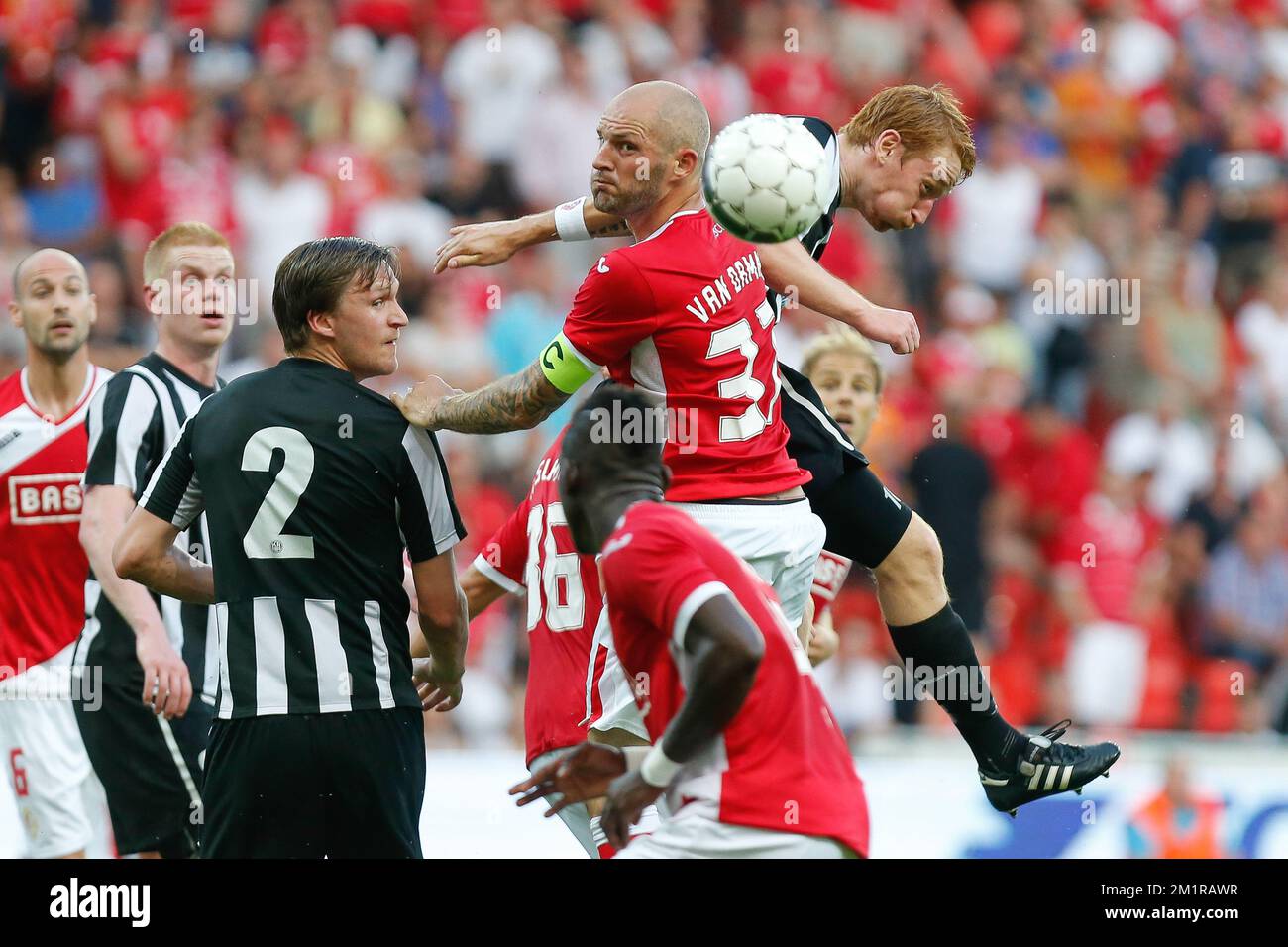 Standard's Jelle Van Damme and KR Reykjavikís Aron Bjarki Josepsson fight for the ball during the return leg game of the second preliminary round of Europa League with Belgian first division soccer team Standard de Liege against Icelandic team KR Reykjavik, Thursday 25 July 2013, in Liege. Standard won the first leg with a 1-3 score.  Stock Photo