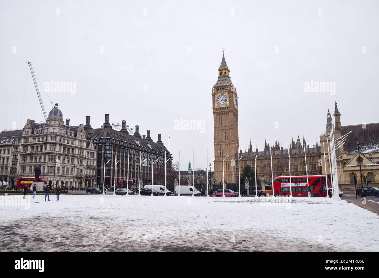 London, UK. 13th December 2022. Snow covers Parliament Square as freezing temperatures continue