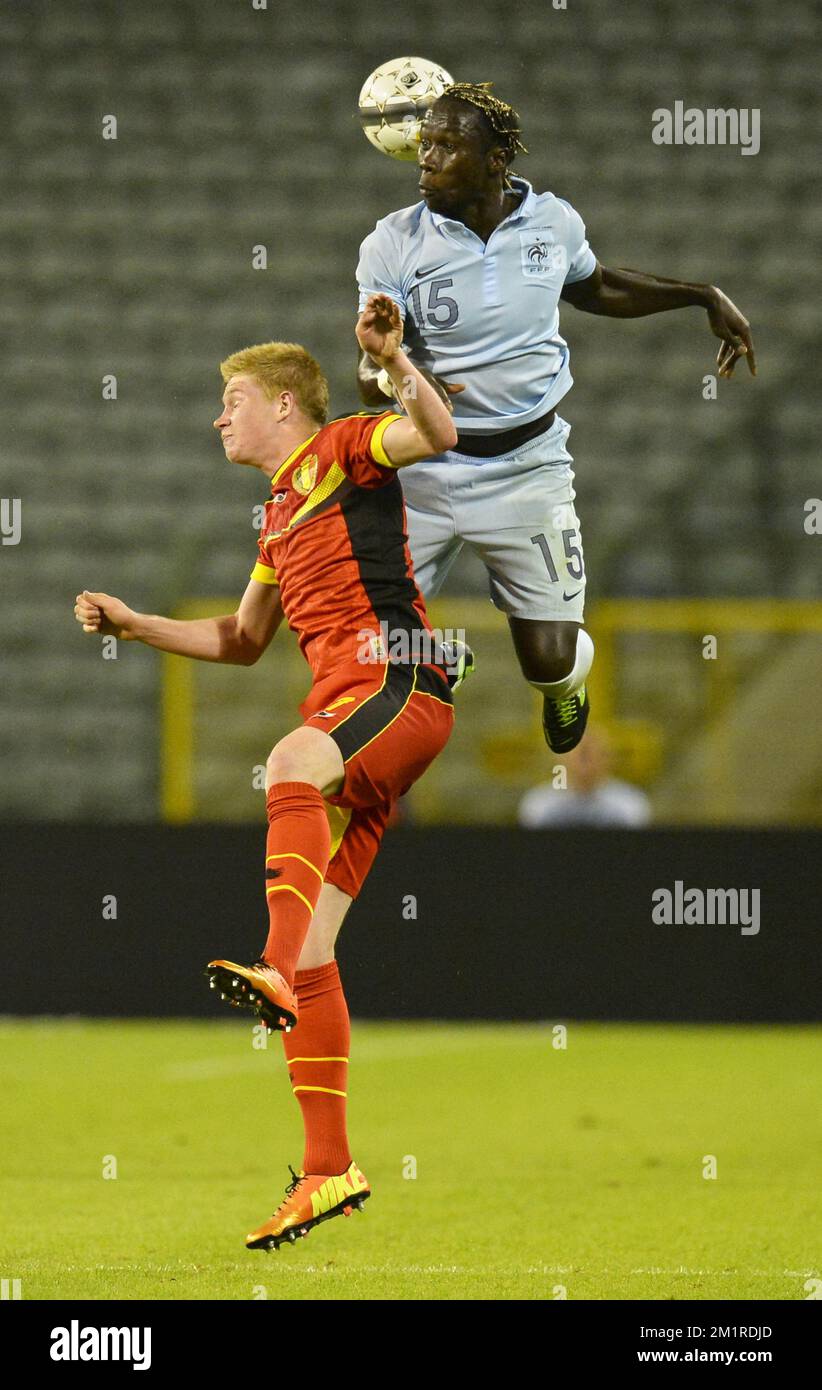 Belgium's Kevin De Bruyne and French Bacary Sagna fight for the ball during a friendly game of the Belgian national soccer team Red Devils against France's national soccer team, Wednesday 14 August 2013, in the King Baudouin Stadium (Stade Roi Baudouin/Koning Boudewijnstadion), in Brussels.  Stock Photo