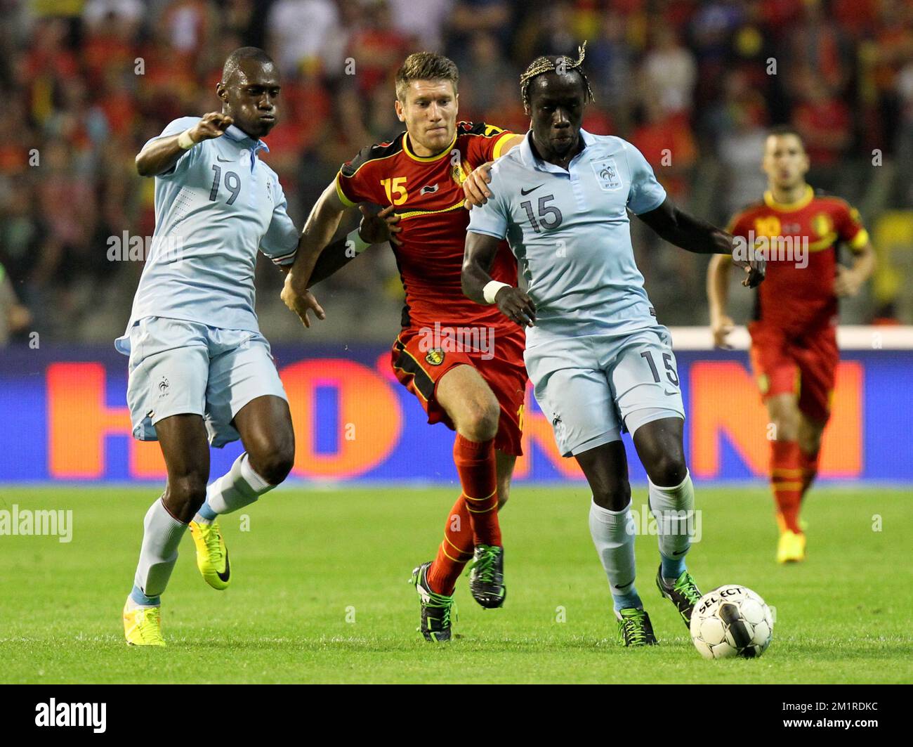 Belgium's Sebastien Pocognoli and French Bacary Sagna fight for the ball during a friendly game of the Belgian national soccer team Red Devils against France's national soccer team, Wednesday 14 August 2013, in the King Baudouin Stadium (Stade Roi Baudouin/Koning Boudewijnstadion), in Brussels.  Stock Photo