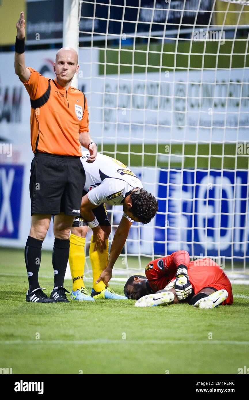 Lokeren's goalkeeper Barry Boubacar Copa lies injured on the ground during the Jupiler Pro League match between KSC Lokeren and KRC Genk, in Lokeren, Saturday 17 August 2013, on day 04 of the Belgian soccer championship.  Stock Photo