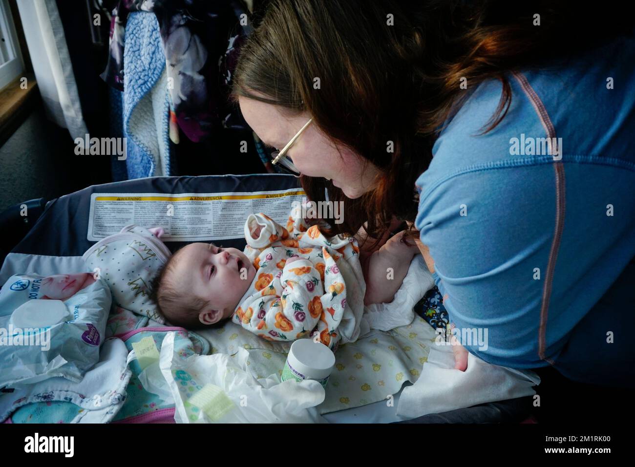 Young mother with new baby 2 months old. Stock Photo