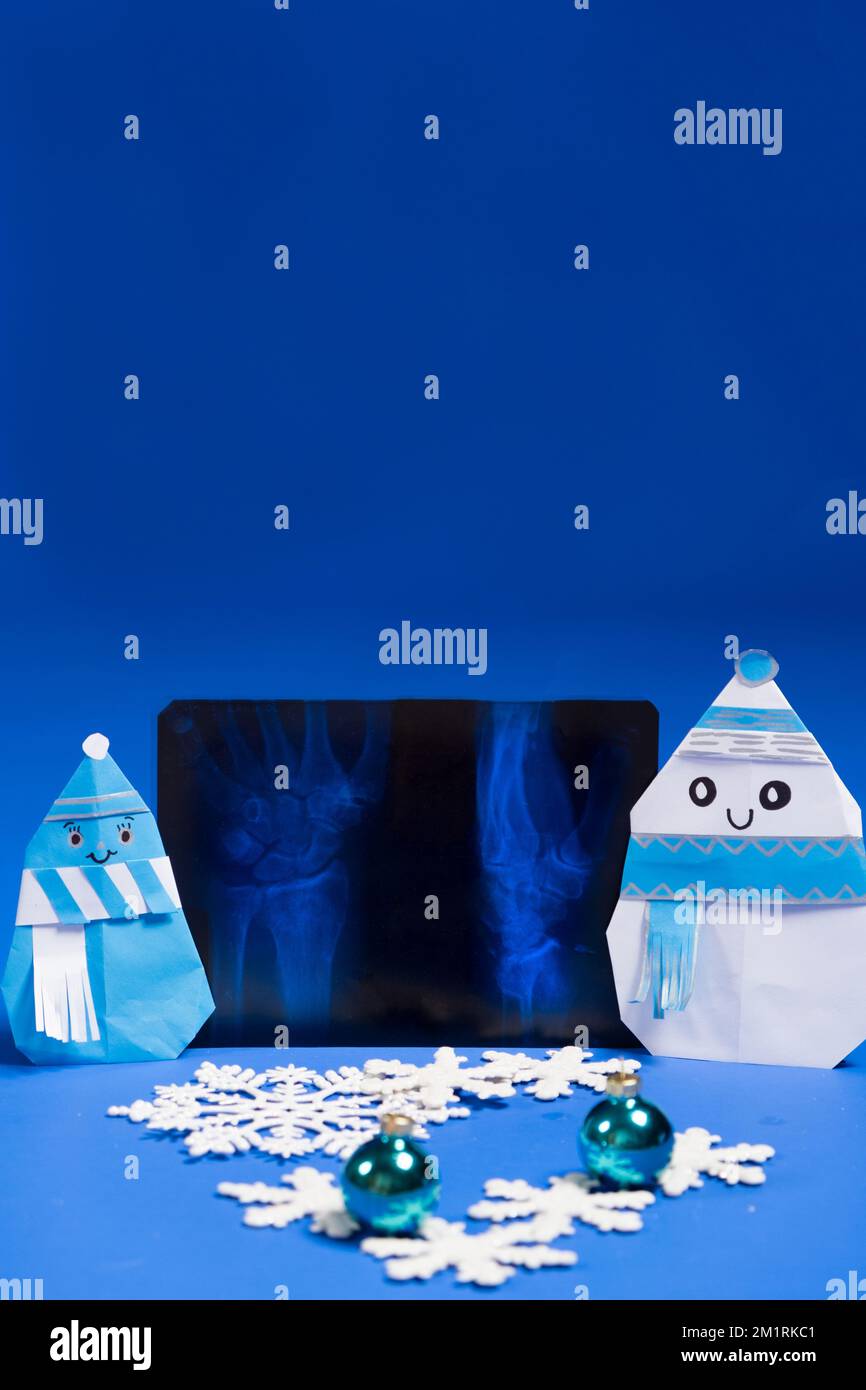 Christmas radiology Xrays, snowmen and snowflakes on a blue