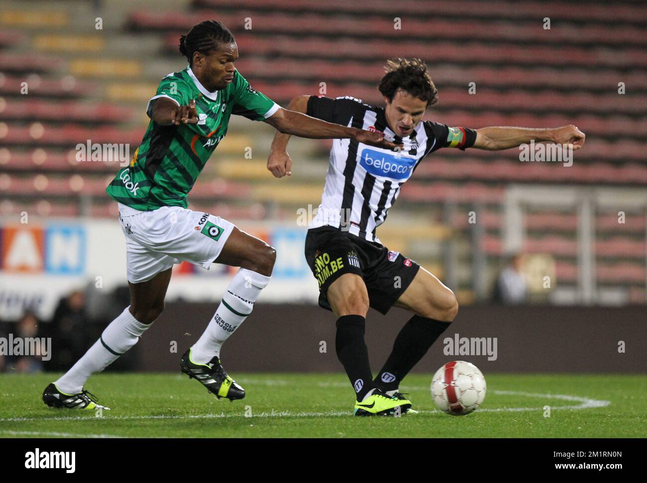 Cercle's Michael Uchebo and Charleroi's Ederson Tormena fight for the ball during the Jupiler Pro League match between Sporting Charleroi and Cercle Brugge KSV, in Charleroi, Saturday 21 September 2013, on day 8 of the Belgian soccer championship. BELGA PHOTO VIRGINIE LEFOUR Stock Photo