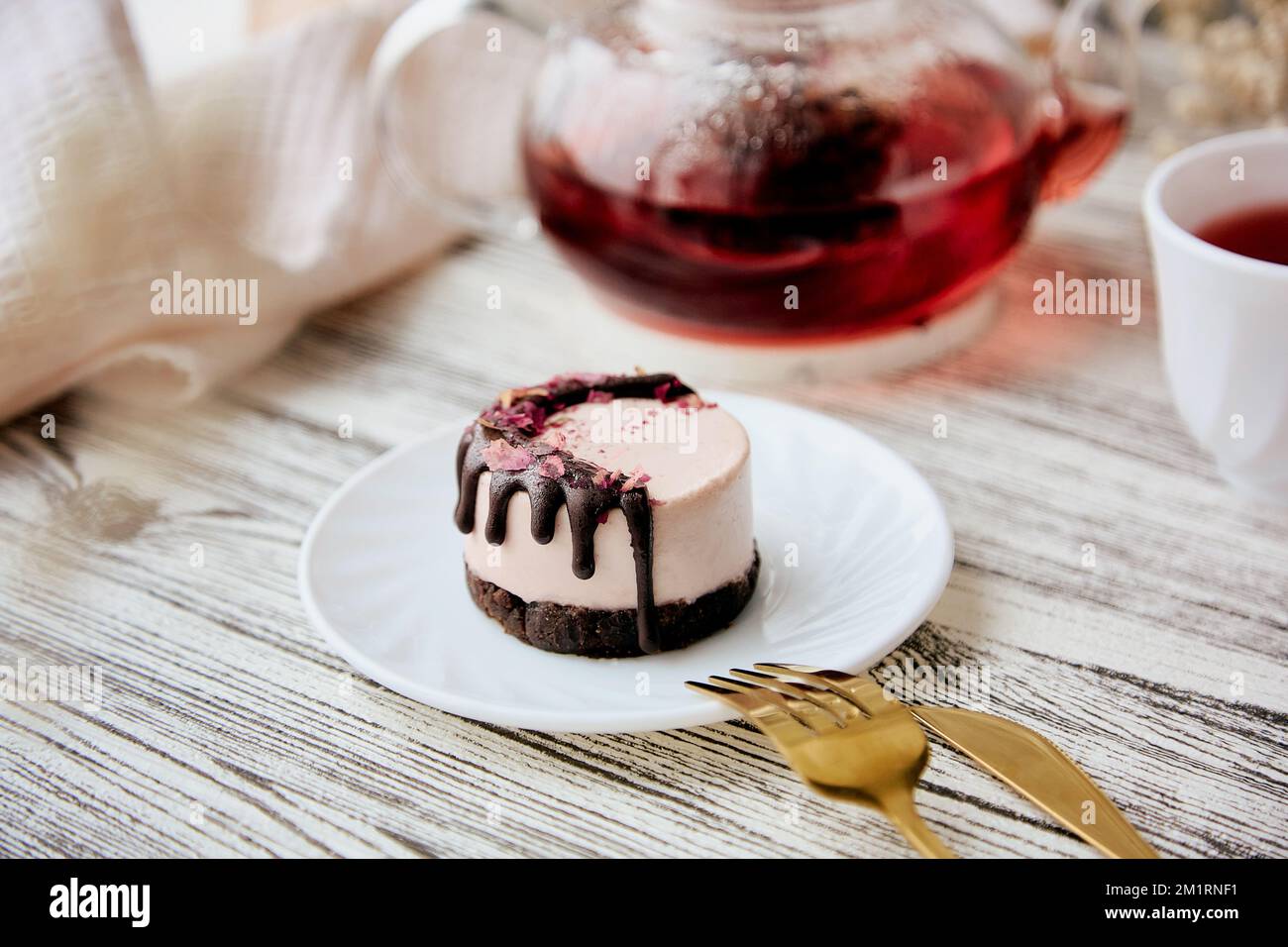 Raspberry vegan gluten and sugar free cake with carob near berries organic tea. Healthy breakfast. Stock Photo