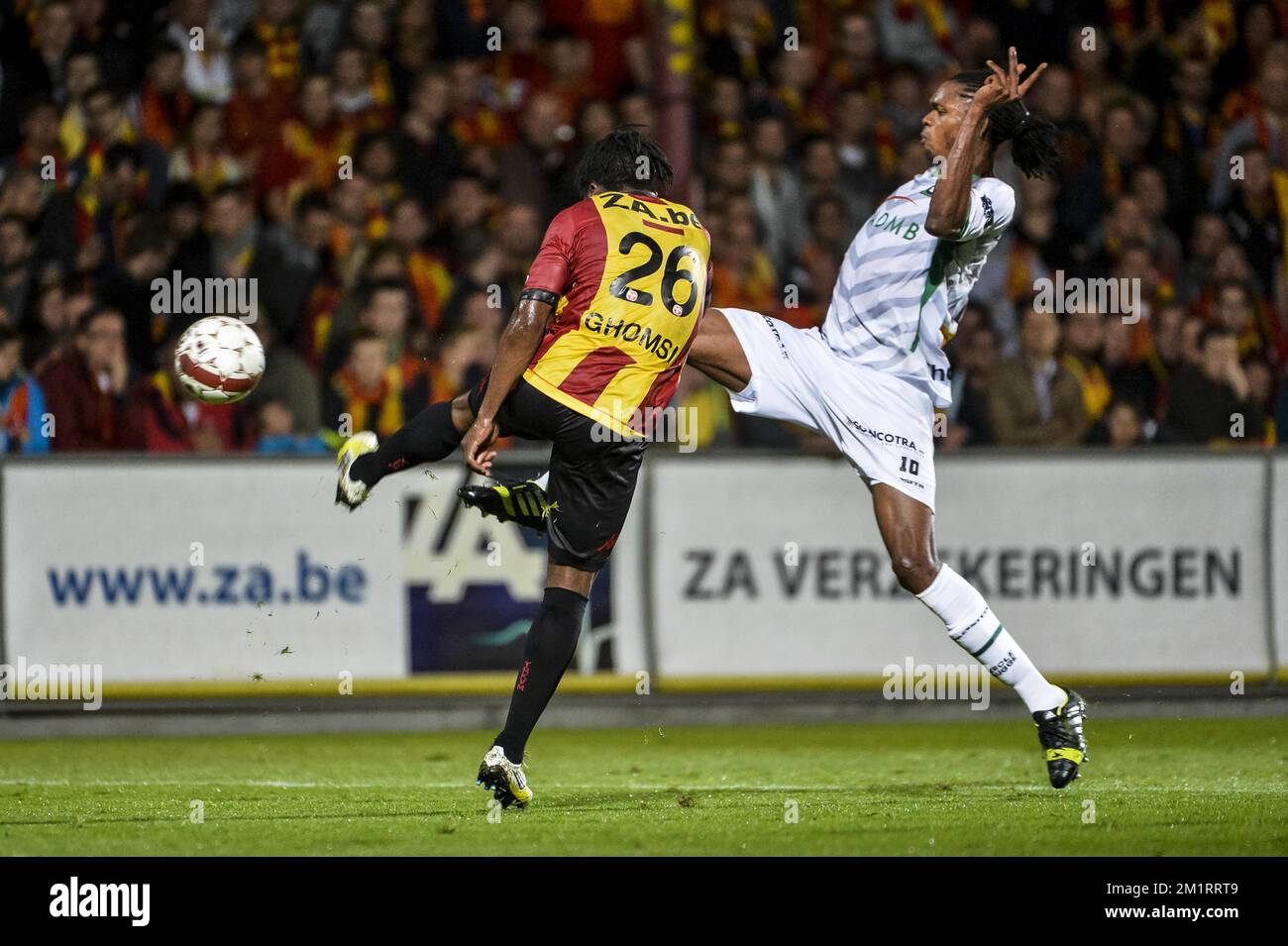 Mechelen's Antonio Ghomsi and Cercle's Michael Uchebo fight for the ball during the Jupiler Pro League match between KV Mechelen and Cercle Brugge, in Mechelen, Saturday 05 October 2013, on day 10 of the Belgian soccer championship.  Stock Photo
