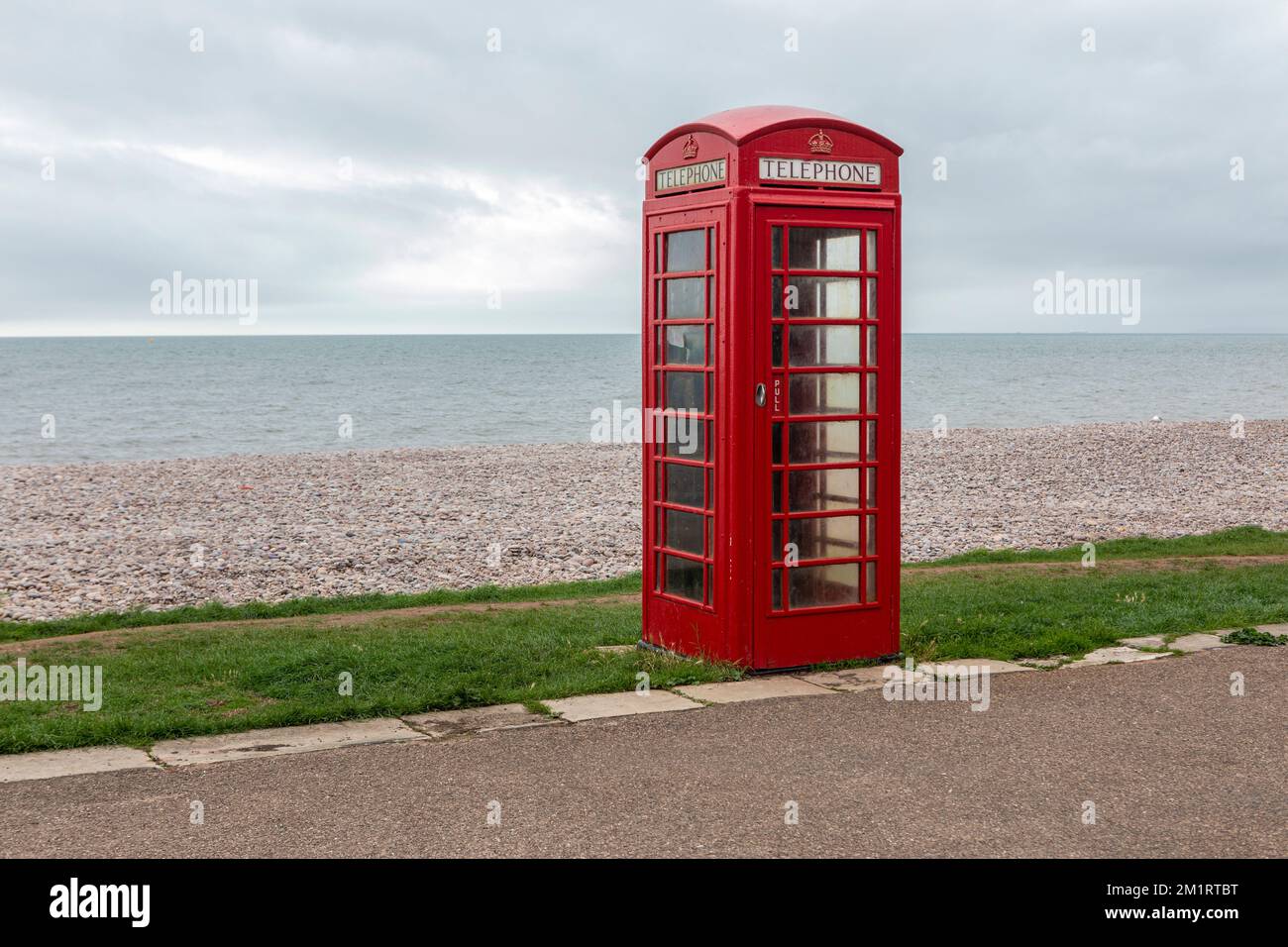 A classic red K2 phone box on Budleigh Salterton beach, Devon Stock Photo