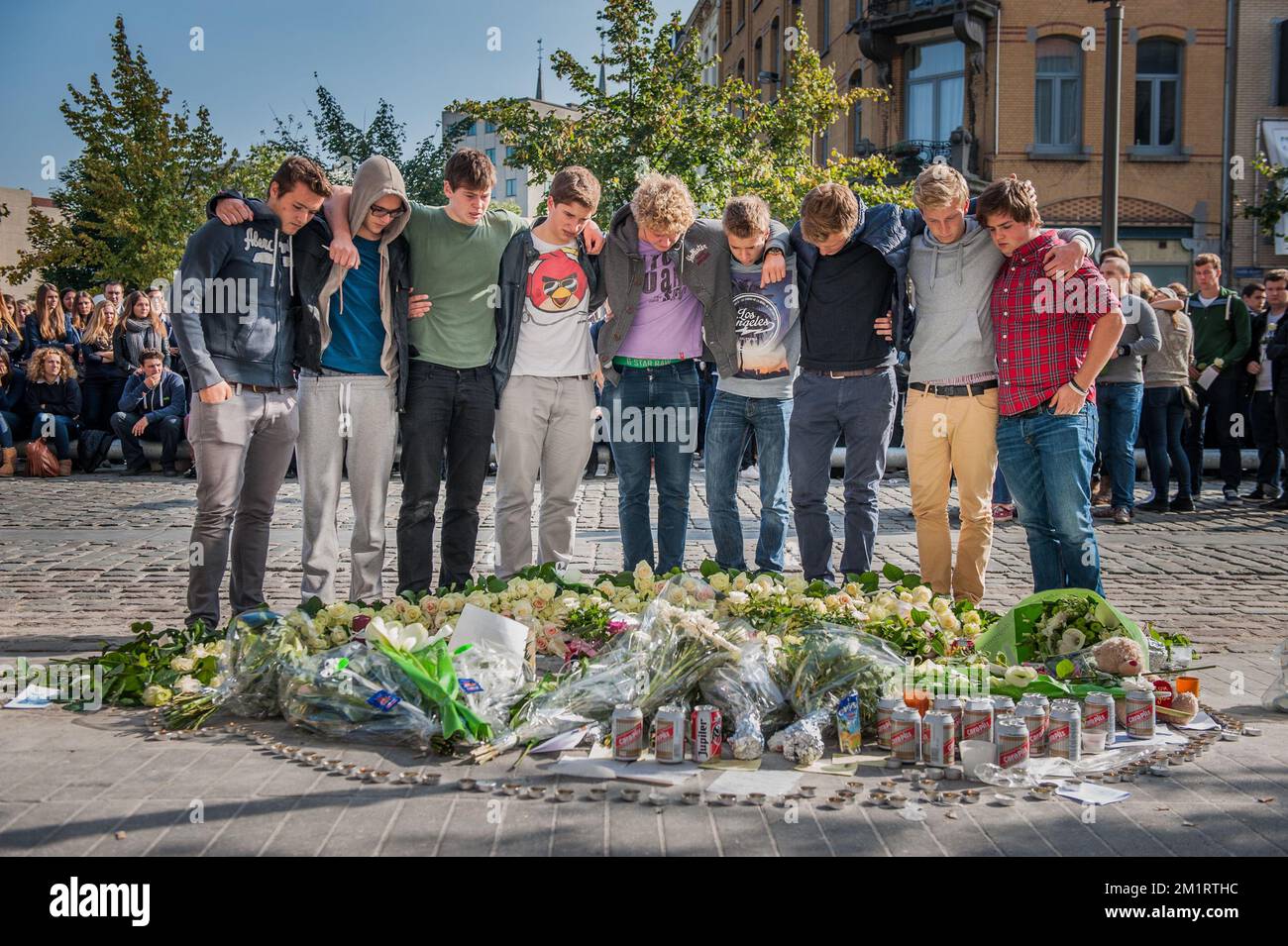 Fellow students of Gregory Bluj pay their respects during a silent