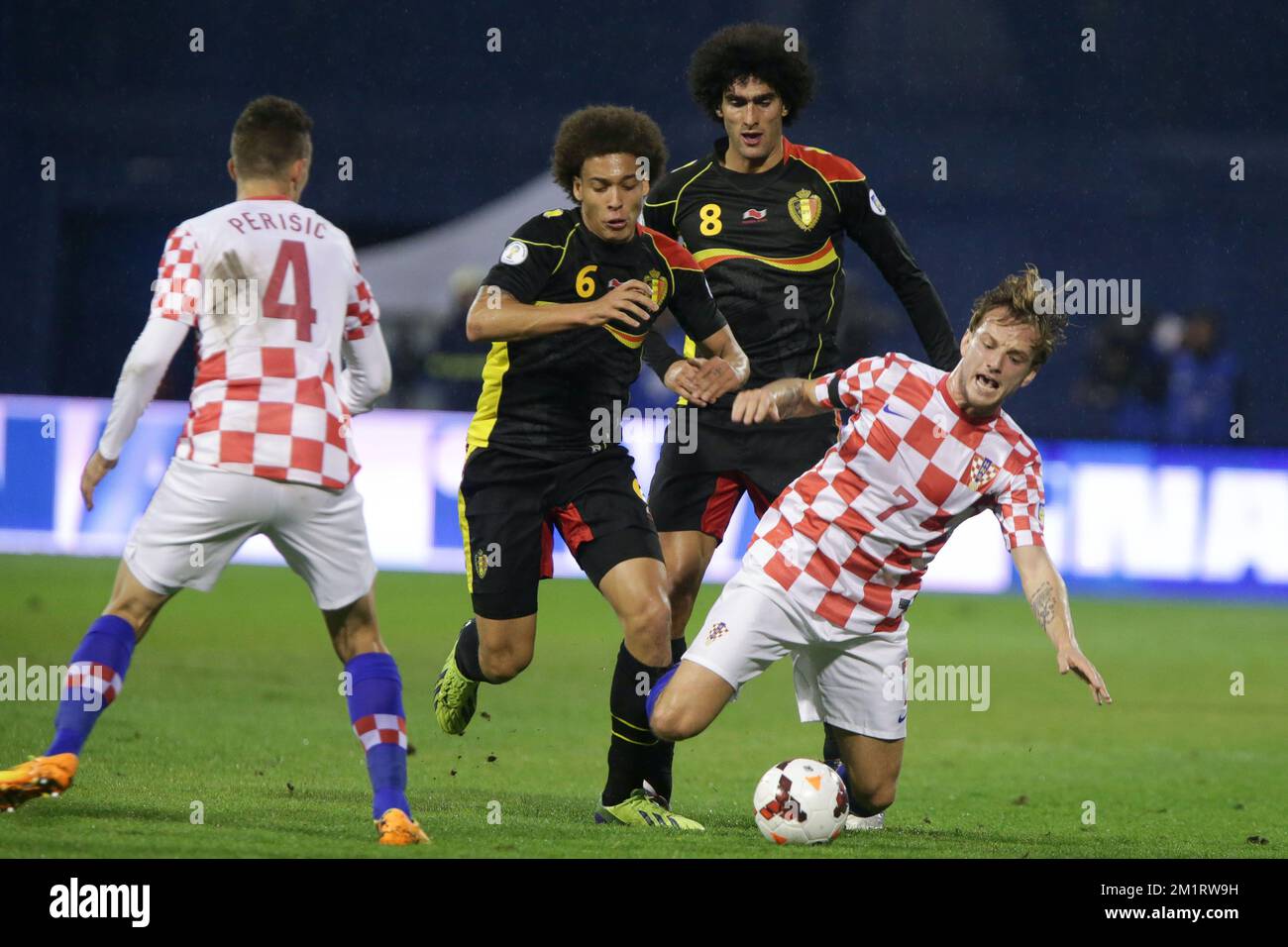 20131011 - ZAGREB, CROATIA: Croatia's Ivan Perisic, Belgium's Axel Witsel, Belgium's Marouane Fellaini and Croatia's Ivan Rakitic fight for the ball during a soccer game between Belgian national team The Red Devils and the Croatian national team in the Maksimir stadium in Zagreb, Croatia, Friday 11 October 2013, a qualification game for the 2014 FIFA World Cup. The Red Devils won the match and qualified for the 2014 FIFA World Cup in Brazil. BELGA PHOTO PRIMOZ LAVRE Stock Photo