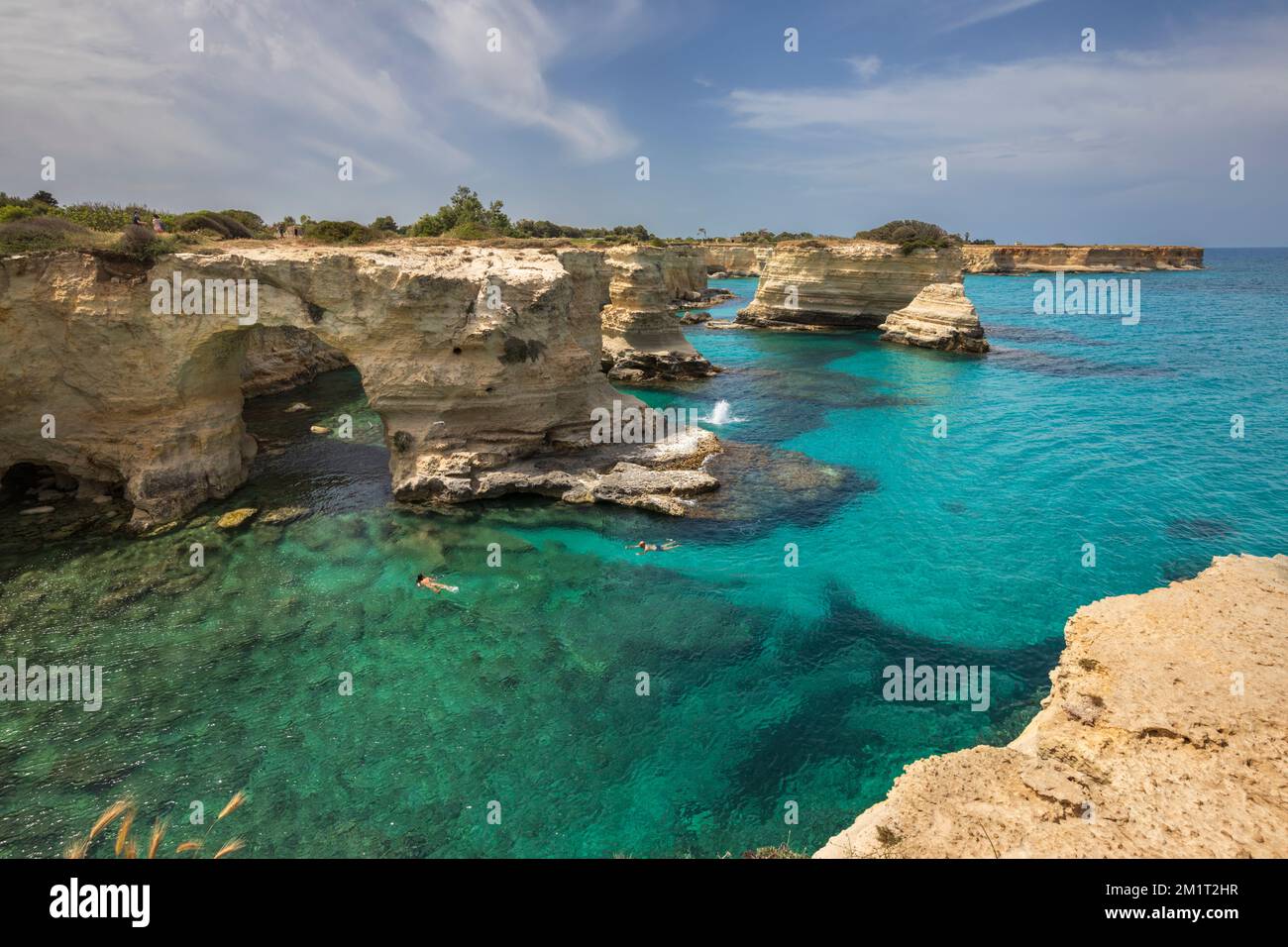 Rock stacks and crystal clear turquoise sea of the Faraglioni di Sant Andrea, Torre di Sant Andrea, Melendugno, Lecce Province, Puglia, Italy, Europe Stock Photo