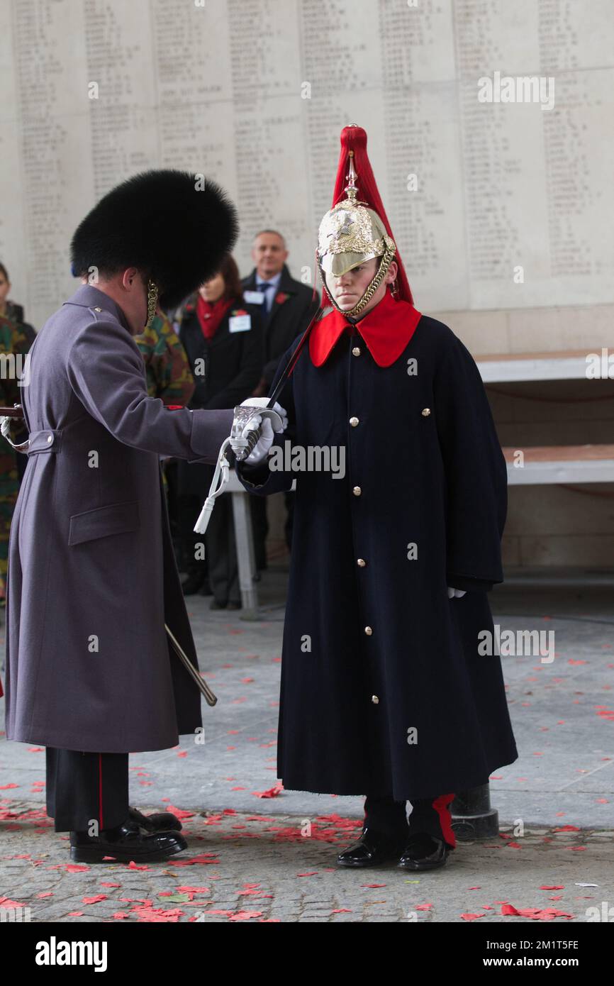 20131111 - IEPER, BELGIUM: Illustration picture shows the Last Post ceremony, a commemoration of World War I (1914-1918), commonly known as Remembrance Day, at the Menenport, in Ieper (Ypres), Monday 11 November 2013. Ahead of the centenary of the start of the WWI, 70 bags of sacred soil from the battlefield and cemeteries in the area will be delivered to a delegation of the prestigious Guards Regiment on the way to London for the Flanders Field Memorial Garden to the memory of British soldiers who fell during WWI. The ceasefire went into effect in 1918 as Germany signed an armistice agreement Stock Photo