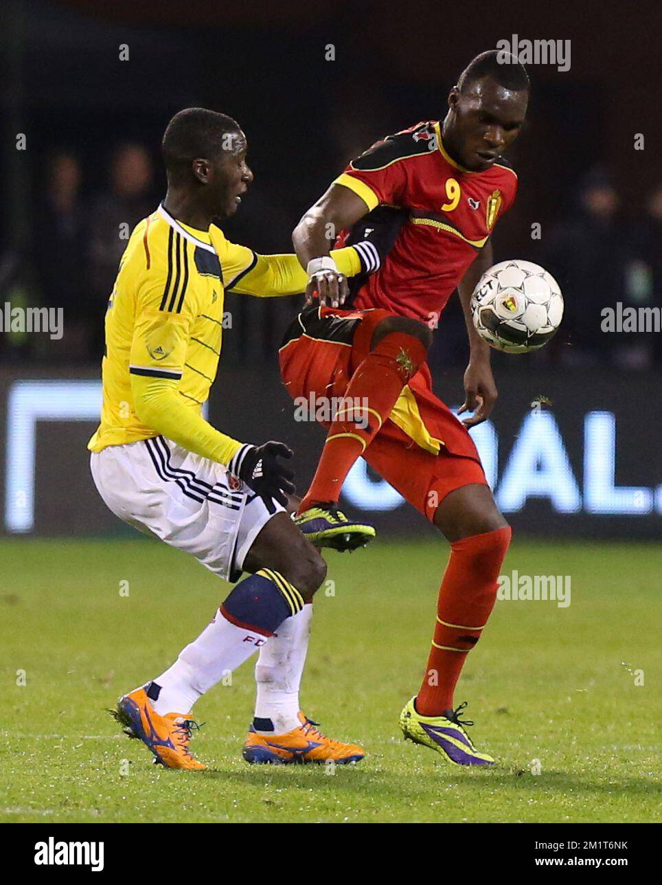 Colombia's Cristian Zapata and Belgium's Christian Benteke fight for the ball during a friendly soccer game between the Belgian national soccer team Red Devils and Colombia, at the Koning Boudewijn Stadion - Stade Roi Baudouin in Brussels, on Thursday 14 November 2013. BELGA PHOTO VIRGINIE LEFOUR Stock Photo