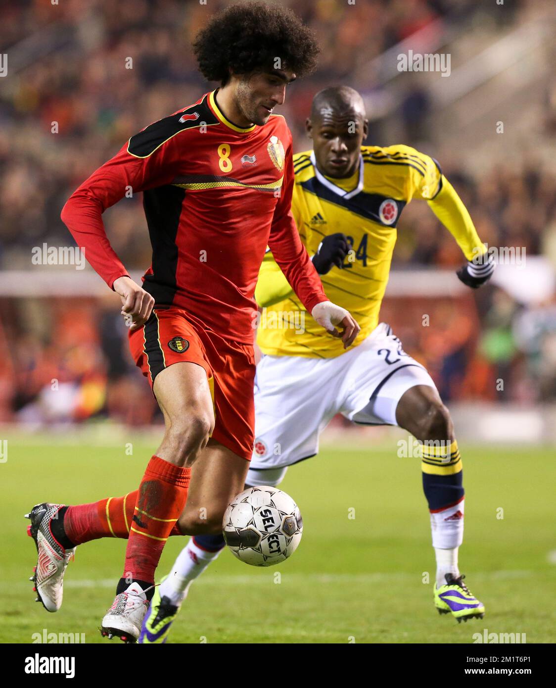 Belgium's Marouane Fellaini and Colombia's Victor Ibarbo fight for the ball during a friendly soccer game between the Belgian national soccer team Red Devils and Colombia, at the Koning Boudewijn Stadion - Stade Roi Baudouin in Brussels, on Thursday 14 November 2013. BELGA PHOTO VIRGINIE LEFOUR Stock Photo
