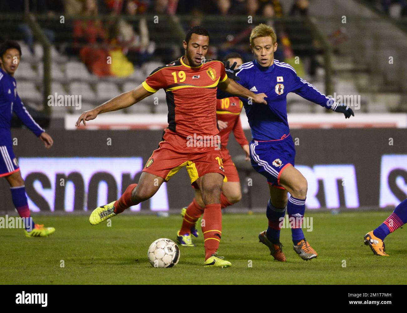 Belgium's Moussa Dembele and Japan's Keisuke Honda fight for the ball during the friendly match between Belgian national soccer team Red Devils and Japan, on Tuesday 19 November 2013, in Brussels. BELGA PHOTO DIRK WAEM Stock Photo