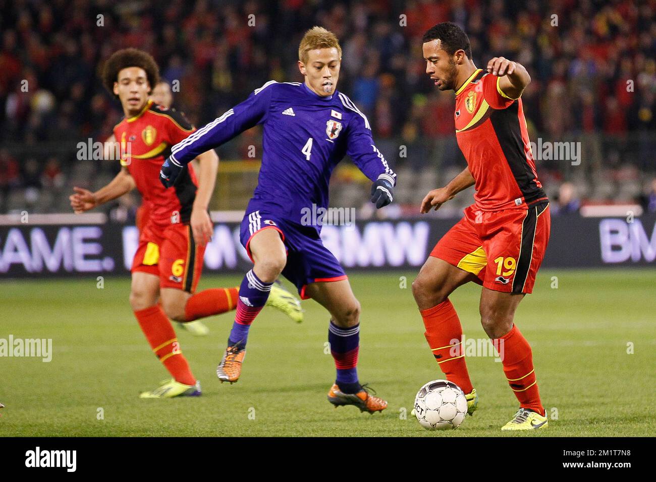 Japan's Keisuke Honda and Belgium's Moussa Dembele fight for the ball during the friendly match between Belgian national soccer team Red Devils and Japan, on Tuesday 19 November 2013, in Brussels. BELGA PHOTO BRUNO FAHY Stock Photo