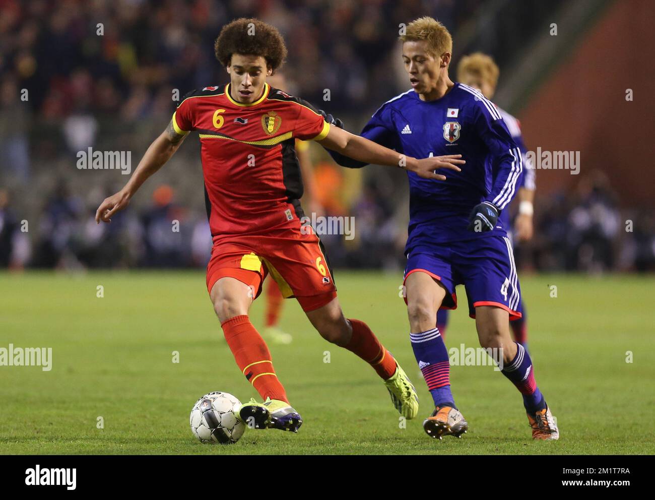 20131119 - BRUSSELS, BELGIUM: Belgium's Axel Witsel and Japan's Keisuke Honda fight for the ball during the friendly match between Belgian national soccer team Red Devils and Japan, on Tuesday 19 November 2013, in Brussels. BELGA PHOTO VIRGINIE LEFOUR Stock Photo
