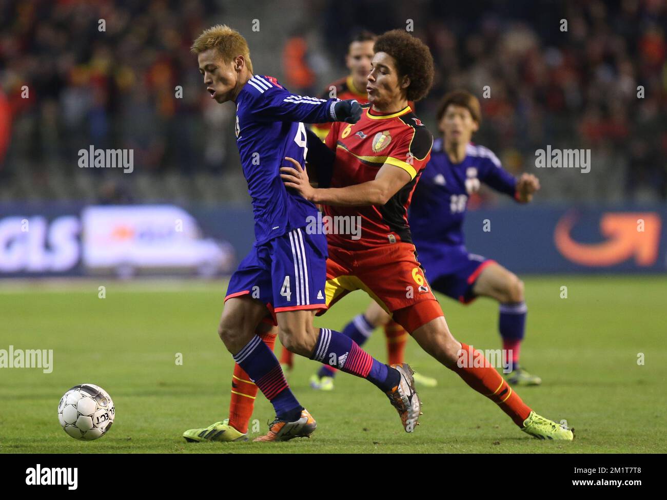 20131119 - BRUSSELS, BELGIUM: Japan's Keisuke Honda and Belgium's Axel Witsel fight for the ball during the friendly match between Belgian national soccer team Red Devils and Japan, on Tuesday 19 November 2013, in Brussels. BELGA PHOTO VIRGINIE LEFOUR Stock Photo
