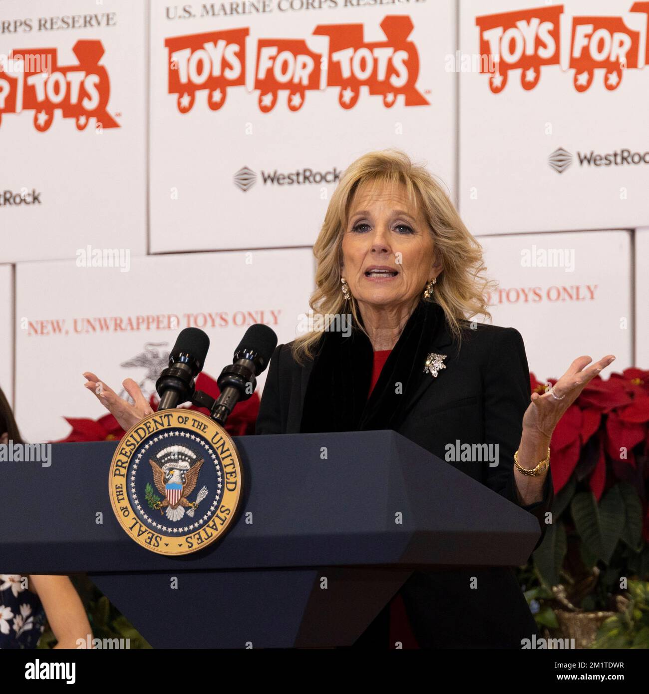 Arlington, United States. 12th Dec, 2022. U.S. First Lady Jill Biden delivers remarks to military families during a Marine Corps Reserve sorting event for Toys for Tots at Joint Base Myer-Henderson Hall, December 12, 2022 in Arlington, Virginia. Credit: Adam Schultz/White House Photo/Alamy Live News Stock Photo