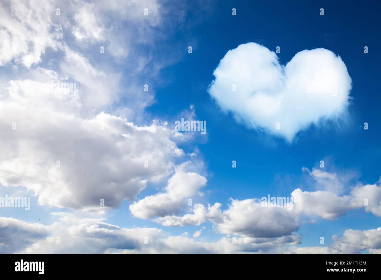 cumulus clouds on blue sky with heart shaped cloud Stock Photo - Alamy