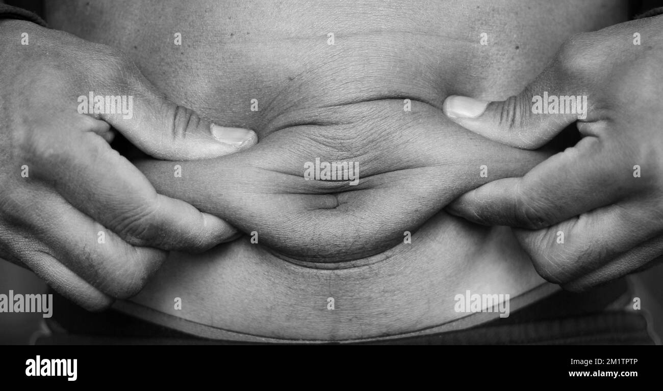 fat on belly waistline with people with people stock photo Stock Photo