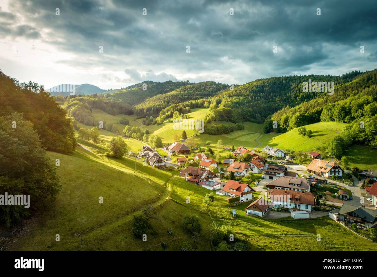 The beautiful view of a village surrounded by green hills. Black Forest