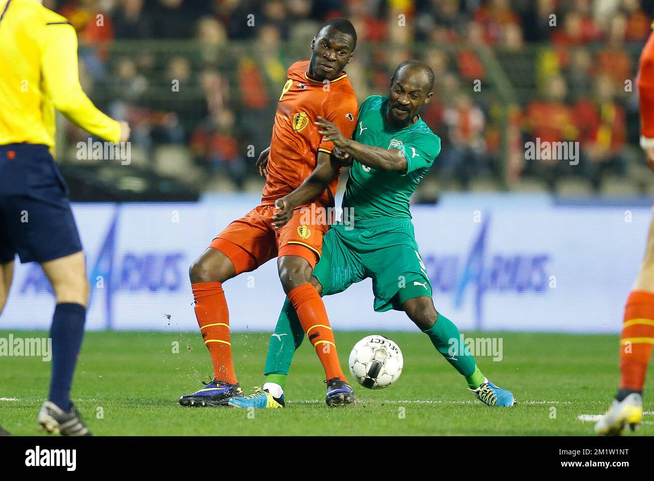 Belgium's Christian Benteke and Ivory Coast's Didier Zokora fight for the ball during a friendly soccer game between the Belgian national team the Red Devils and Ivory Coast, Wednesday 05 March 2014 in Brussels.  Stock Photo