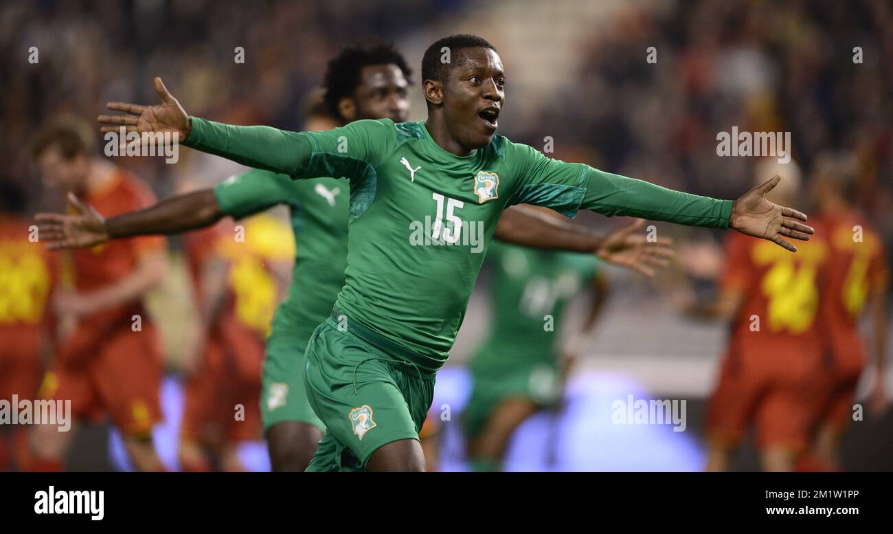 Ivory Coast's Max Gradel celebrates after scoring the 2-2 goal in the last minute of extra time during a friendly soccer game between the Belgian national team the Red Devils and Ivory Coast, Wednesday 05 March 2014 in Brussels.  Stock Photo