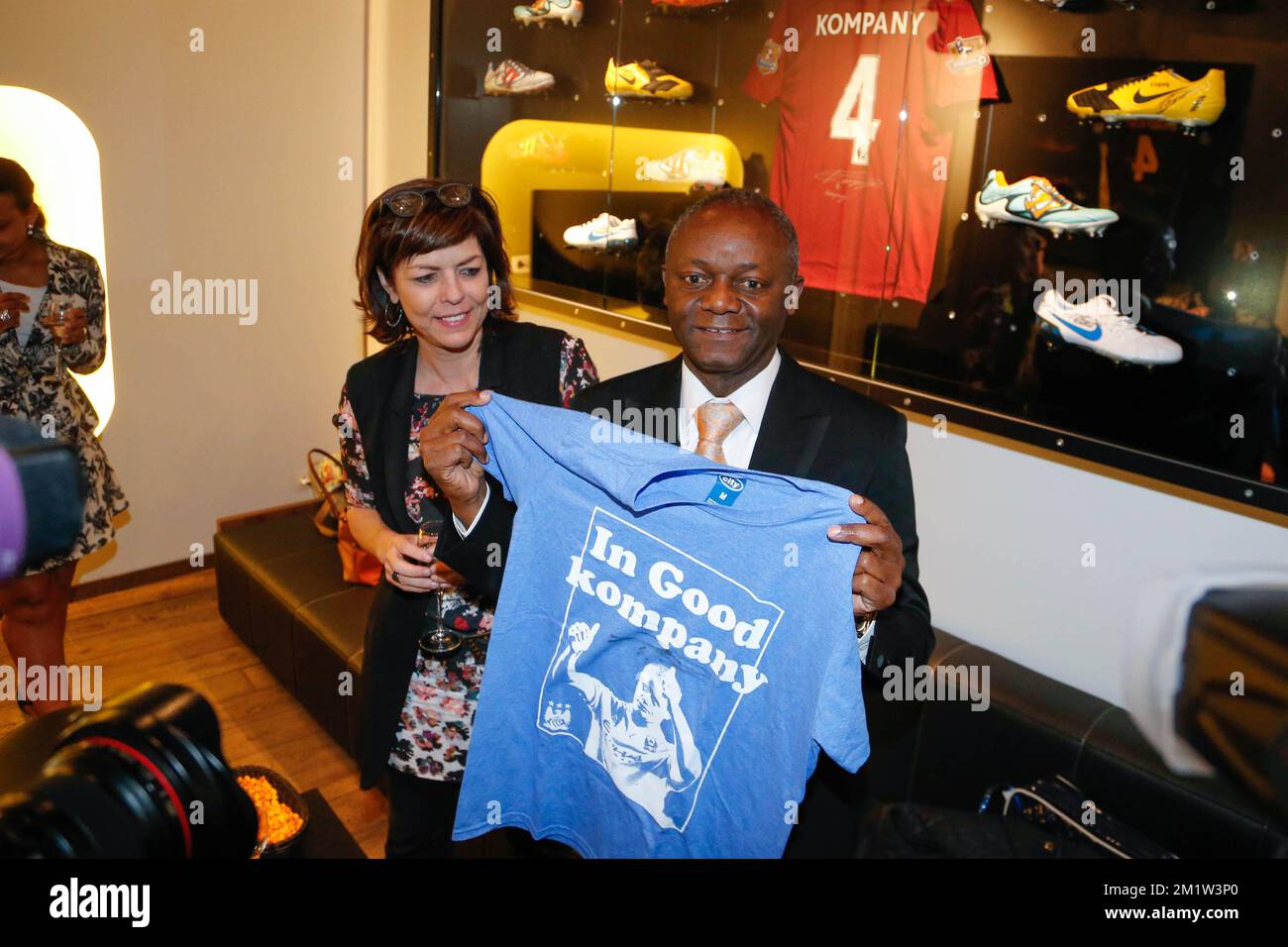 Minister Joelle Milquet and Pierre Kompany pictured during the opening of the 'Good Kompany' sports bar near Grand-Place - Grote Markt in Brussels city center, at the occasion of the opening of this new sports bar owned by international soccer player Vincent Kompany, Friday 18 April 2014.  Stock Photo