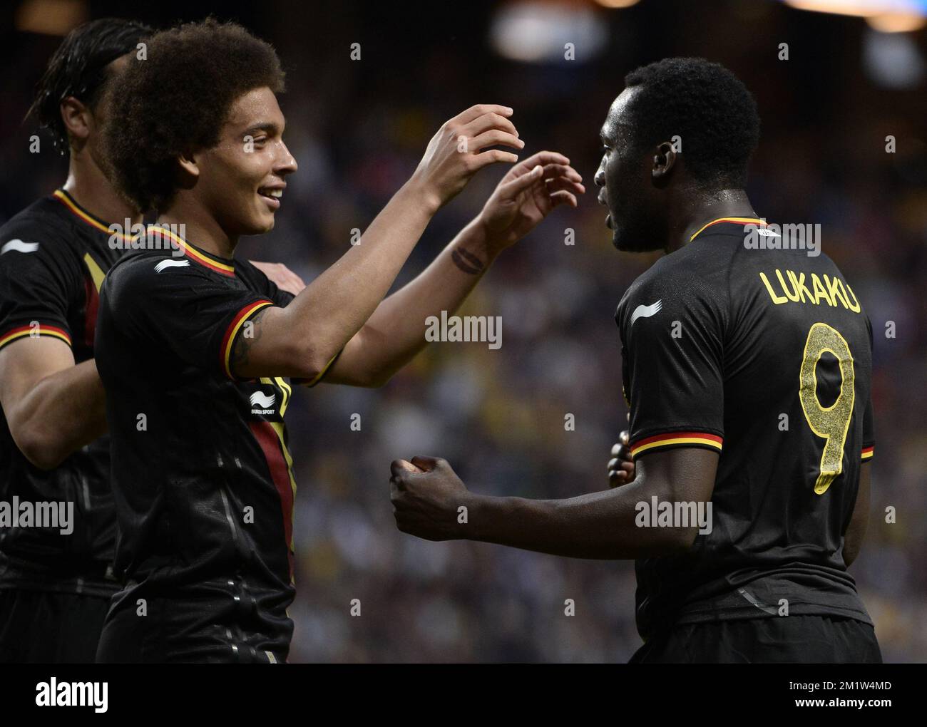 Belgium's Romelu Lukaku celebrates with Axel Witsel after scoring the 0-1 goal at a friendly game between Belgian national soccer team Red Devils and the Swedish national soccer team in the Friends Arena, Sunday 01 June 2014, in Solna, Sweden. The Belgian Red Devils are preparing for the Brazil 2014 World Cup during a training camp in Sweden.  Stock Photo