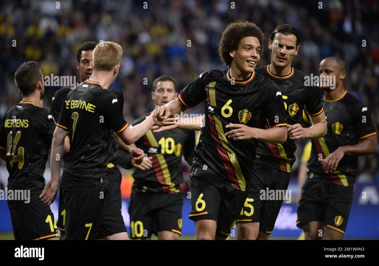 Belgium's Kevin De Bruyne, Belgium's Axel Witsel and Belgium's Daniel Van Buyten celebrate at a friendly game between Belgian national soccer team Red Devils and the Swedish national soccer team in the Friends Arena, Sunday 01 June 2014, in Solna, Sweden. The Belgian Red Devils are preparing for the Brazil 2014 World Cup during a training camp in Sweden.  Stock Photo