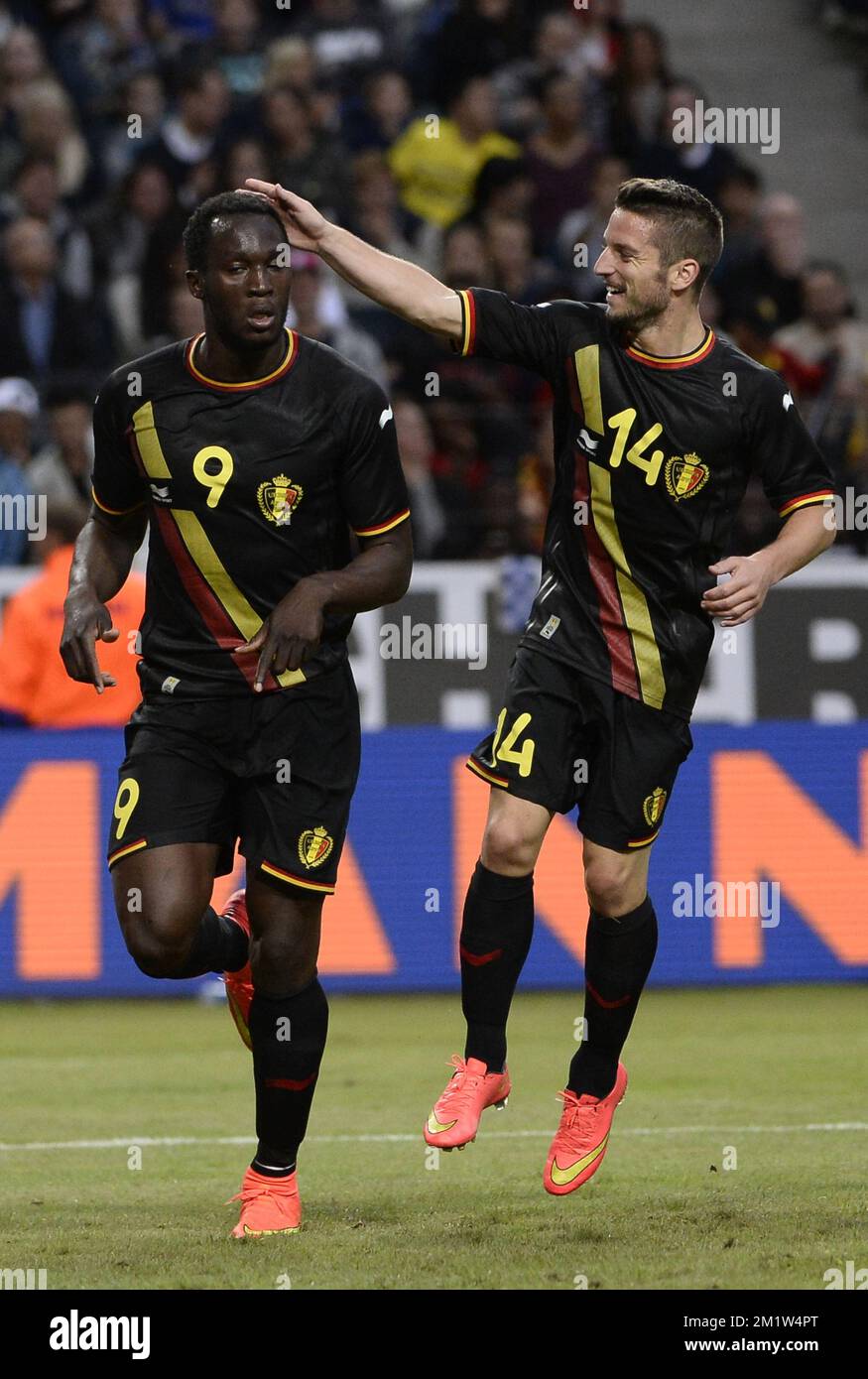 Belgium's Romelu Lukaku celebrates after scoring the 0-1 goal with Belgium's Dries Mertens at a friendly game between Belgian national soccer team Red Devils and the Swedish national soccer team in the Friends Arena, Sunday 01 June 2014, in Solna, Sweden. The Belgian Red Devils are preparing for the Brazil 2014 World Cup during a training camp in Sweden.  Stock Photo