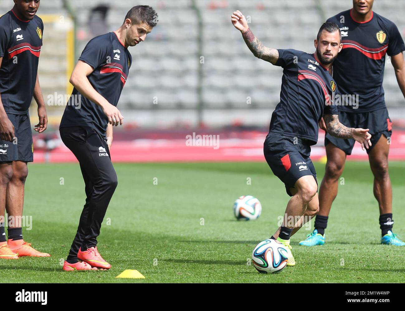 Belgium's Kevin Mirallas and Belgium's Steven Defour fight for the ball during the last training session of the Belgian national soccer team Red Devils before their departure to the World Cup in Brazil, on Sunday 08 June 2014, in Brussels. The 2014 Fifa World Cup takes place from 12 June till 13 July in Brazil. BELGA PHOTO VIRGINIE LEFOUR Stock Photo