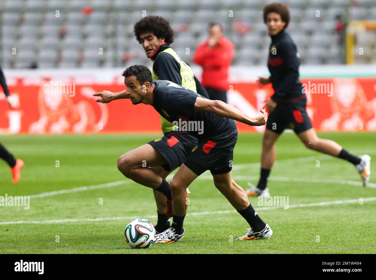Belgium's Marouane Fellaini and Belgium's Nacer Chadli fight for the ball during the last training session of the Belgian national soccer team Red Devils before their departure to the World Cup in Brazil, on Sunday 08 June 2014, in Brussels. The 2014 Fifa World Cup takes place from 12 June till 13 July in Brazil. BELGA PHOTO VIRGINIE LEFOUR Stock Photo