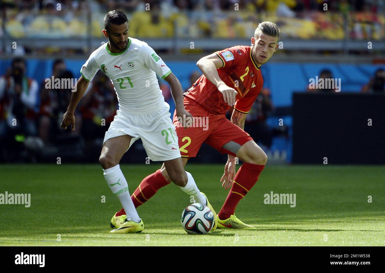 Algeria's Riyad Mahrez and Belgium's Toby Alderweireld fight for the ball during a soccer game between Belgian national team The Red Devils and Algeria in Belo Horizonte, Brazil, the first game in Group H of the first round of the 2014 FIFA World Cup, Tuesday 17 June 2014.  Stock Photo