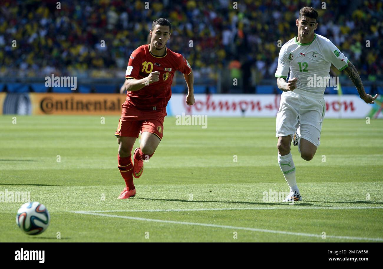 Belgium's Eden Hazard and Algeria's Carl Medjani fight for the ball during a soccer game between Belgian national team The Red Devils and Algeria in Belo Horizonte, Brazil, the first game in Group H of the first round of the 2014 FIFA World Cup, Tuesday 17 June 2014.  Stock Photo