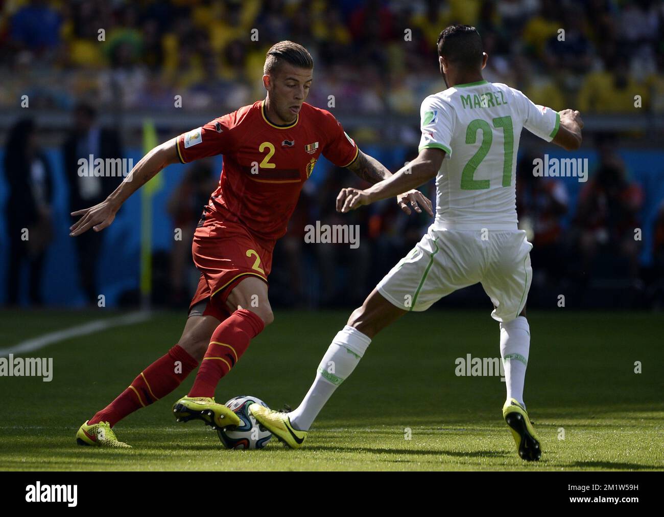 Belgium's Toby Alderweireld and Algeria's Riyad Mahrez fight for the ball during a soccer game between Belgian national team The Red Devils and Algeria in Belo Horizonte, Brazil, the first game in Group H of the first round of the 2014 FIFA World Cup, Tuesday 17 June 2014.  Stock Photo